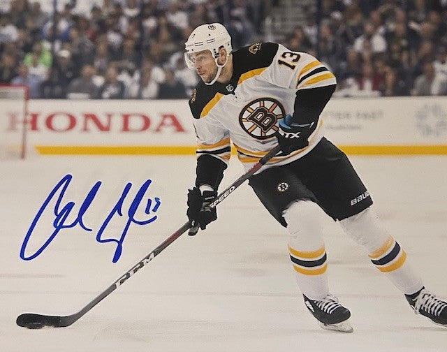 Charlie Coyle signed skating with puck photo