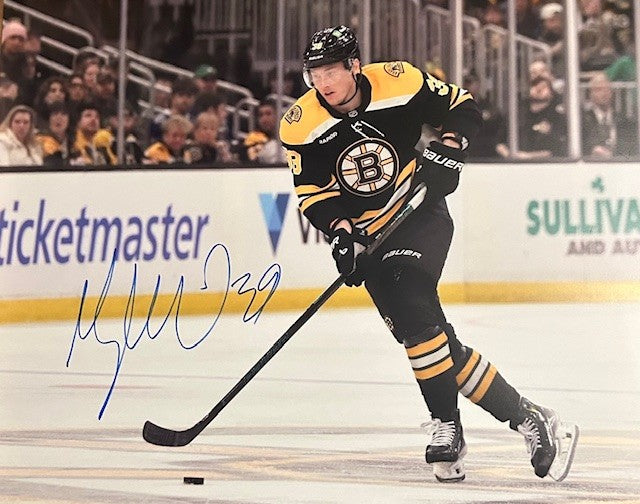 Morgan Geekie signed Bruins photo in black jersey
